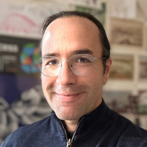 Image of Nathan Freitas, a middle-aged white man with dark hair and glasses, smiling.